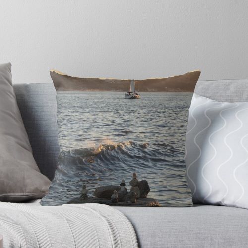 Sailboat at sunset and bollard